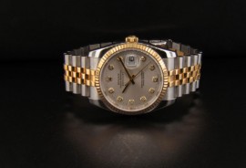 Silver Dial with Gold Dial Hour Markers and Gold Stick Hands